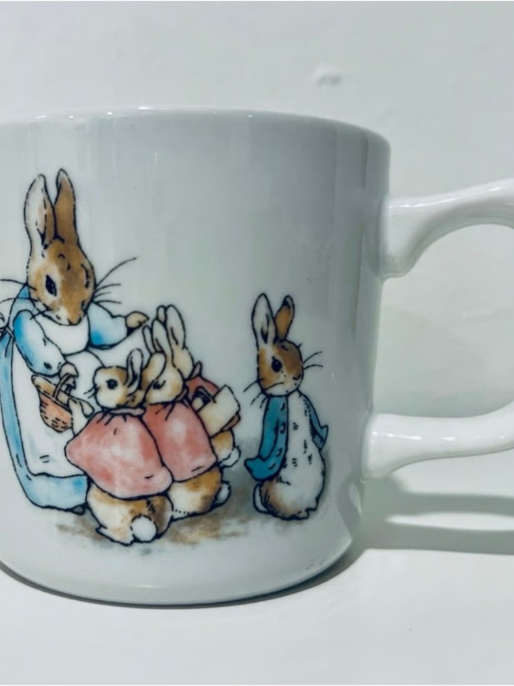 White Ceramic Bunny Family Mug with Pink and Blue Accents